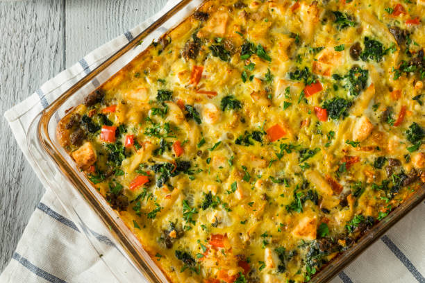 Baked dish with vegetables and cheese in a glass casserole dish