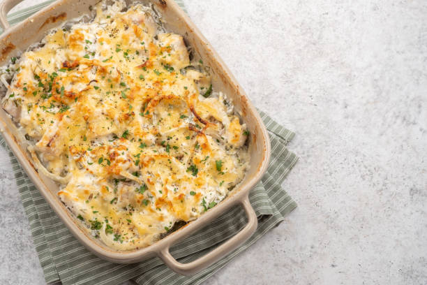 Baked casserole with melted cheese and herbs