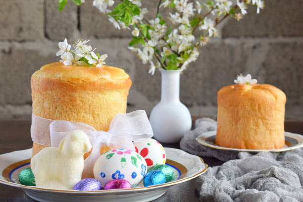 Easter cakes decorated with flowers and colorful eggs on a table