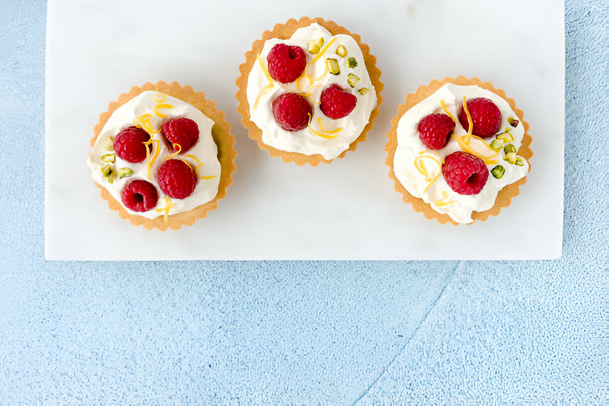 Lemon Cupcakes with Raspberry Buttercream Frosting