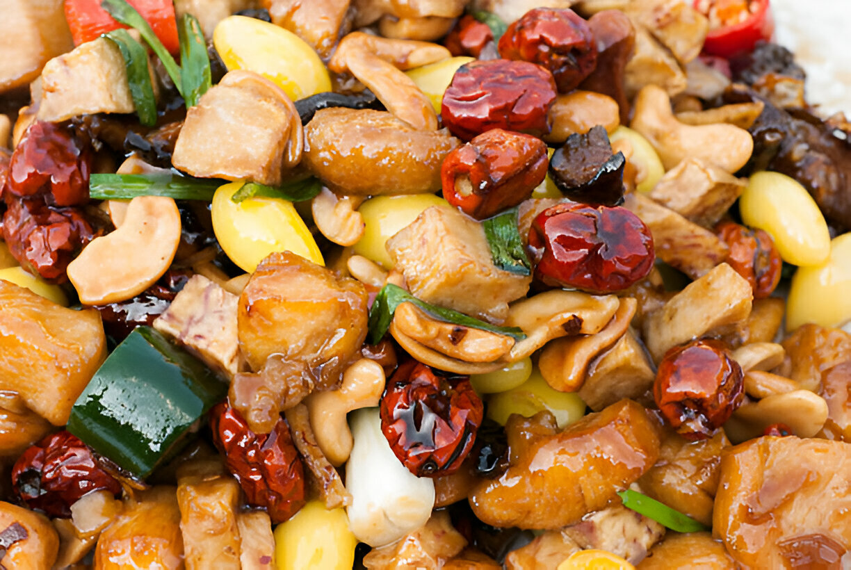 A colorful and flavorful stir-fried dish featuring mixed vegetables, chicken, and cashews.